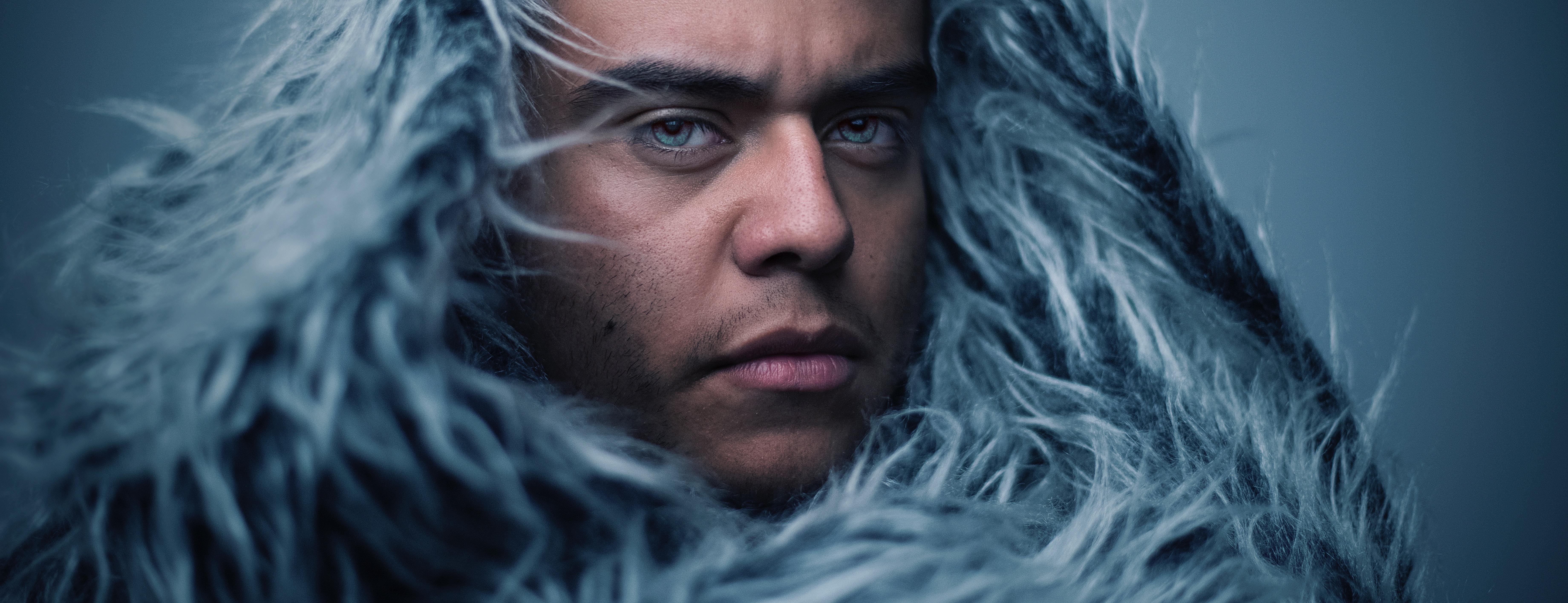 Photo of man in big old furry hoodie by Luke Braswell on Unsplash